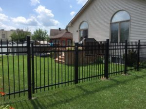 beautiful new backyard metal fence