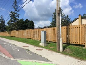 new wood fence surrounding condo property